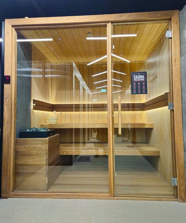SaunaXperts Home 13 Commercial sauna installation with multi-bench seating for gym or fitness club