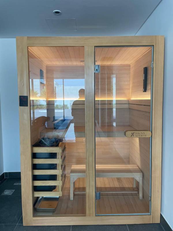SaunaXperts Home 2 Indoor home sauna installation with poolside villa view in Dubai