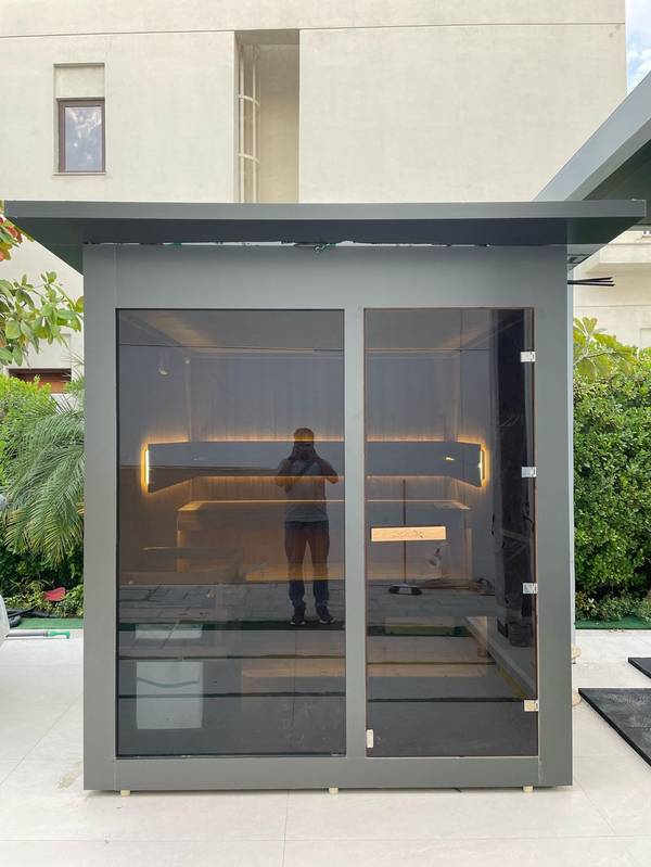 SaunaXperts Home 14 Outdoor sauna cabin installation in a villa garden in the UAE