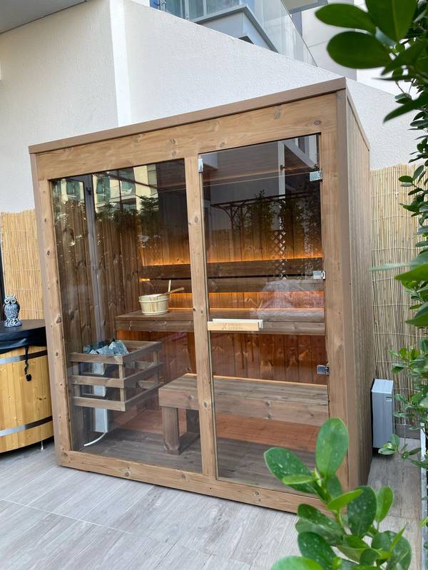 SaunaXperts Home 5 Natural wood outdoor sauna cabin installed on a villa patio in Dubai