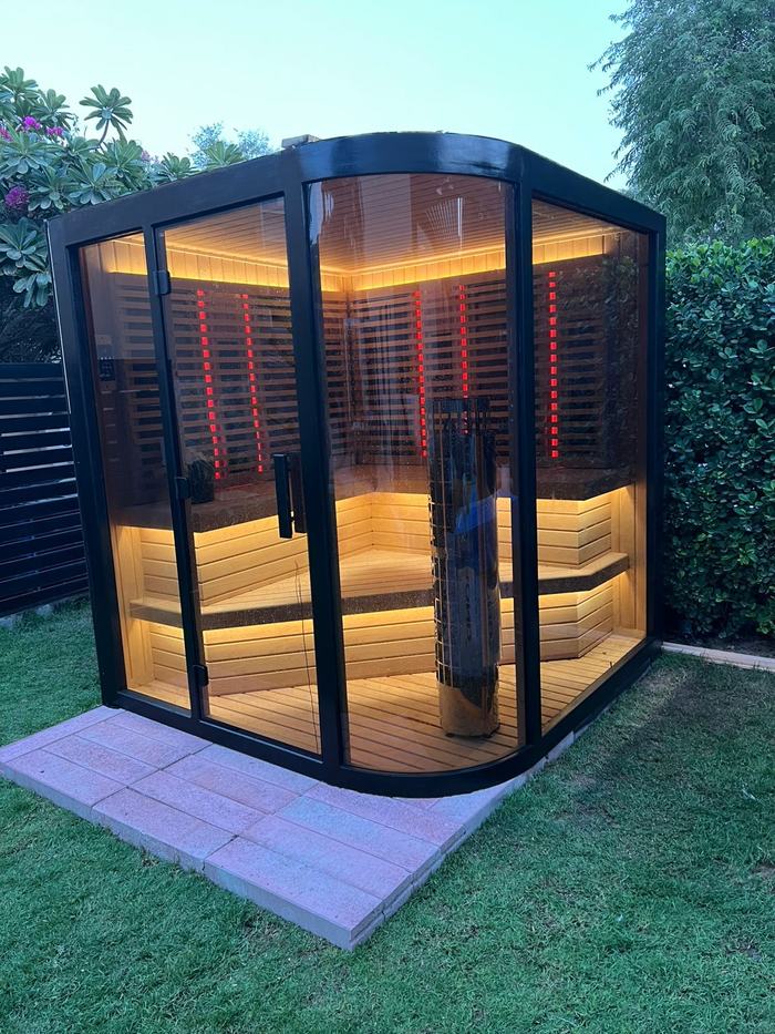 Curve style outdoor hybrid sauna with rounded glass corner, UAE