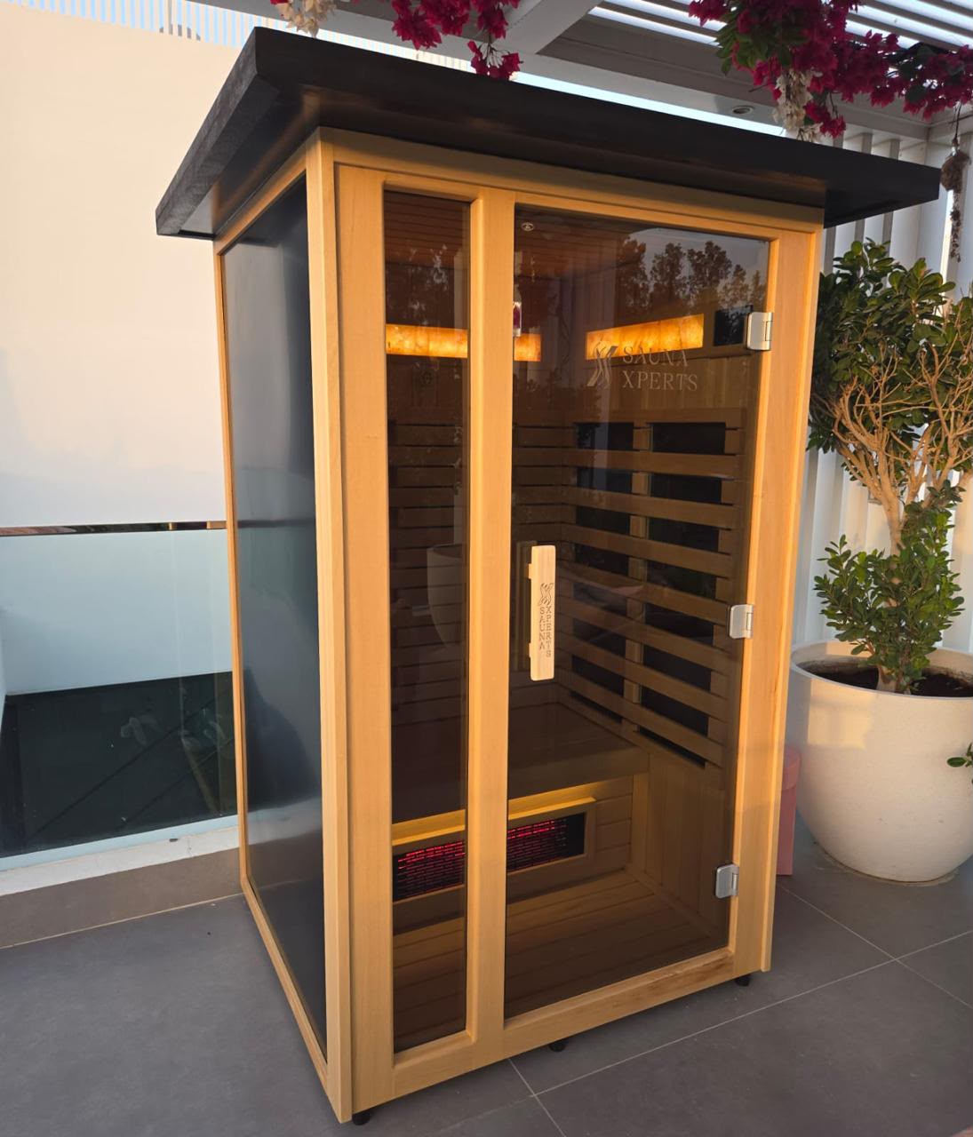 Slatted-wood outdoor sauna cabin
